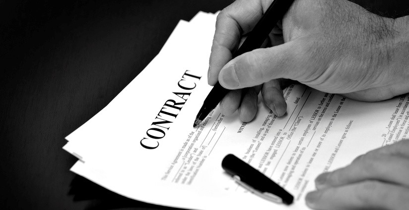 A person signing a contract
AI-generated content may be incorrect.